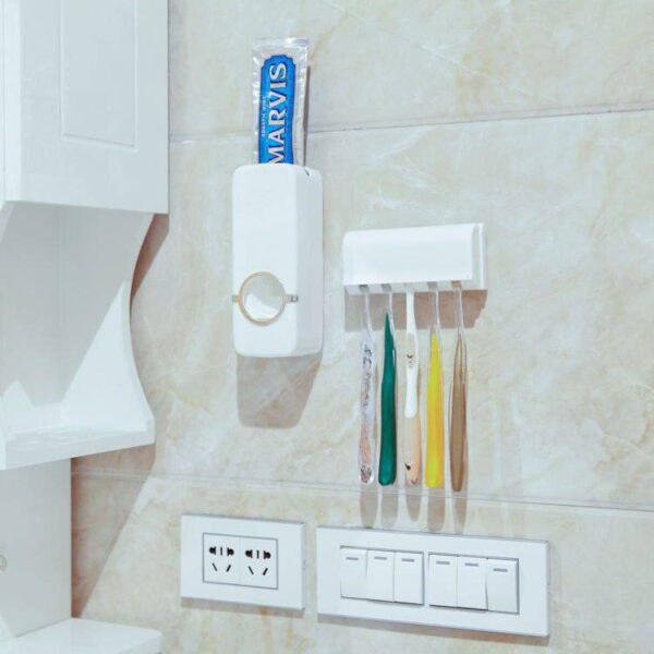 Toothpaste dispenser/brush hanger